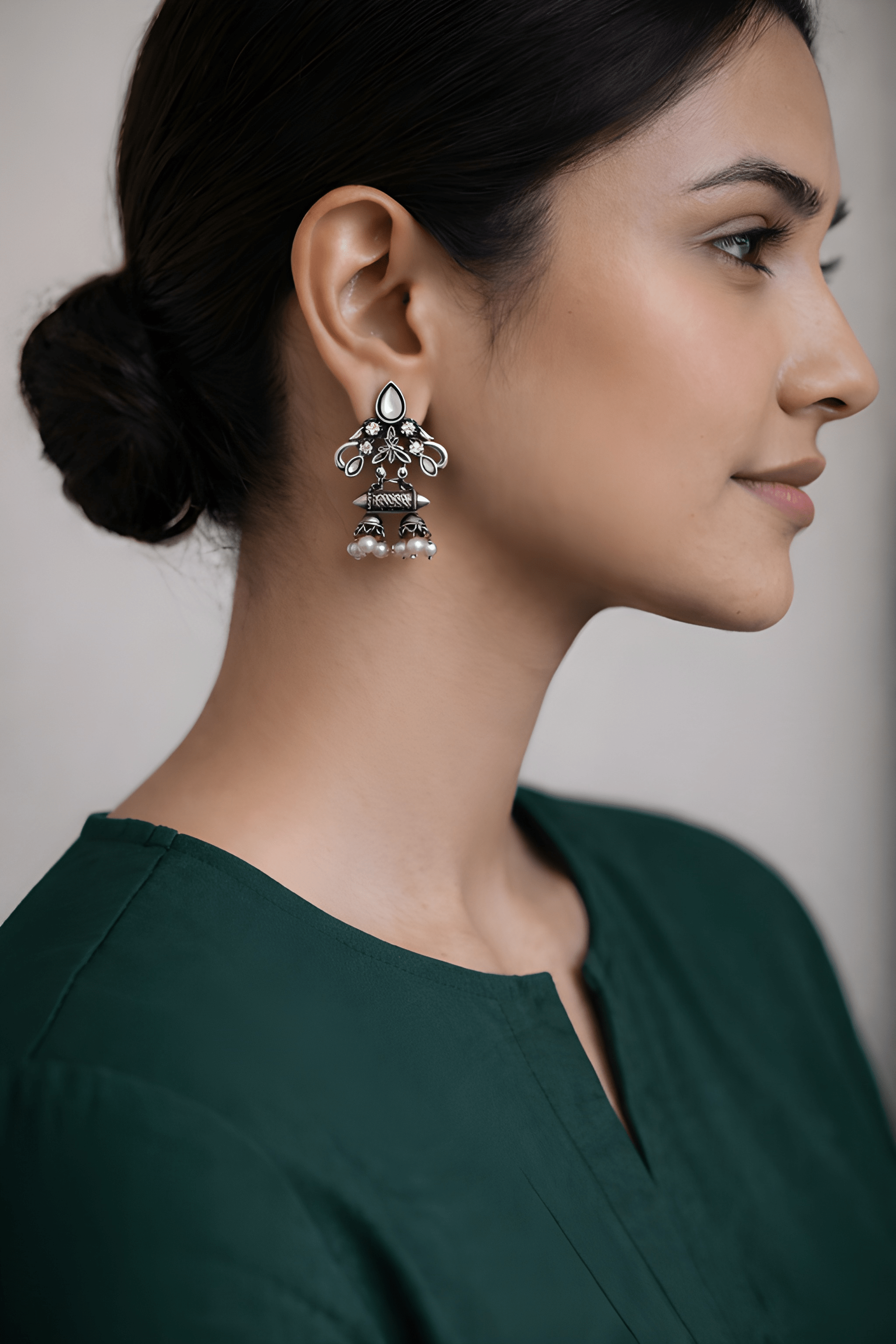 Spiral drop oxidised jhumka earrings worn with ethnic outfit

