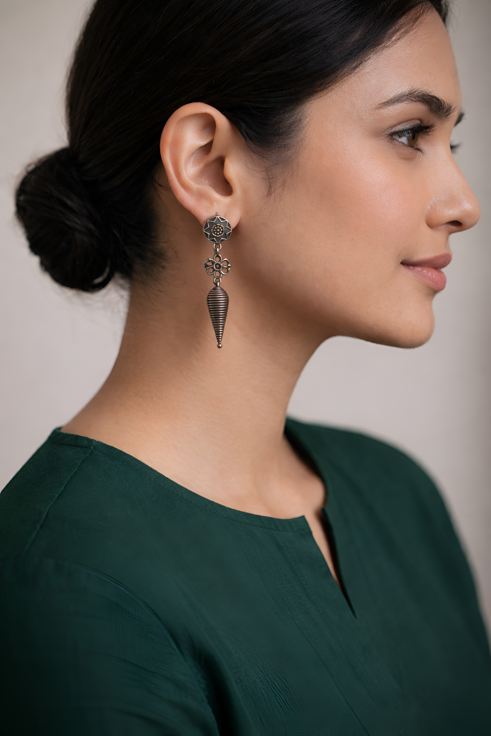 Shell oxidised silver earrings worn for contemporary ethnic styling
