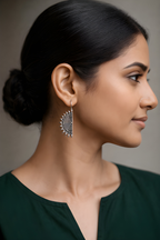 Woman wearing half-moon maze oxidised statement earrings
