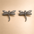 Oxidised silver dragonfly stud earrings with detailed wings
