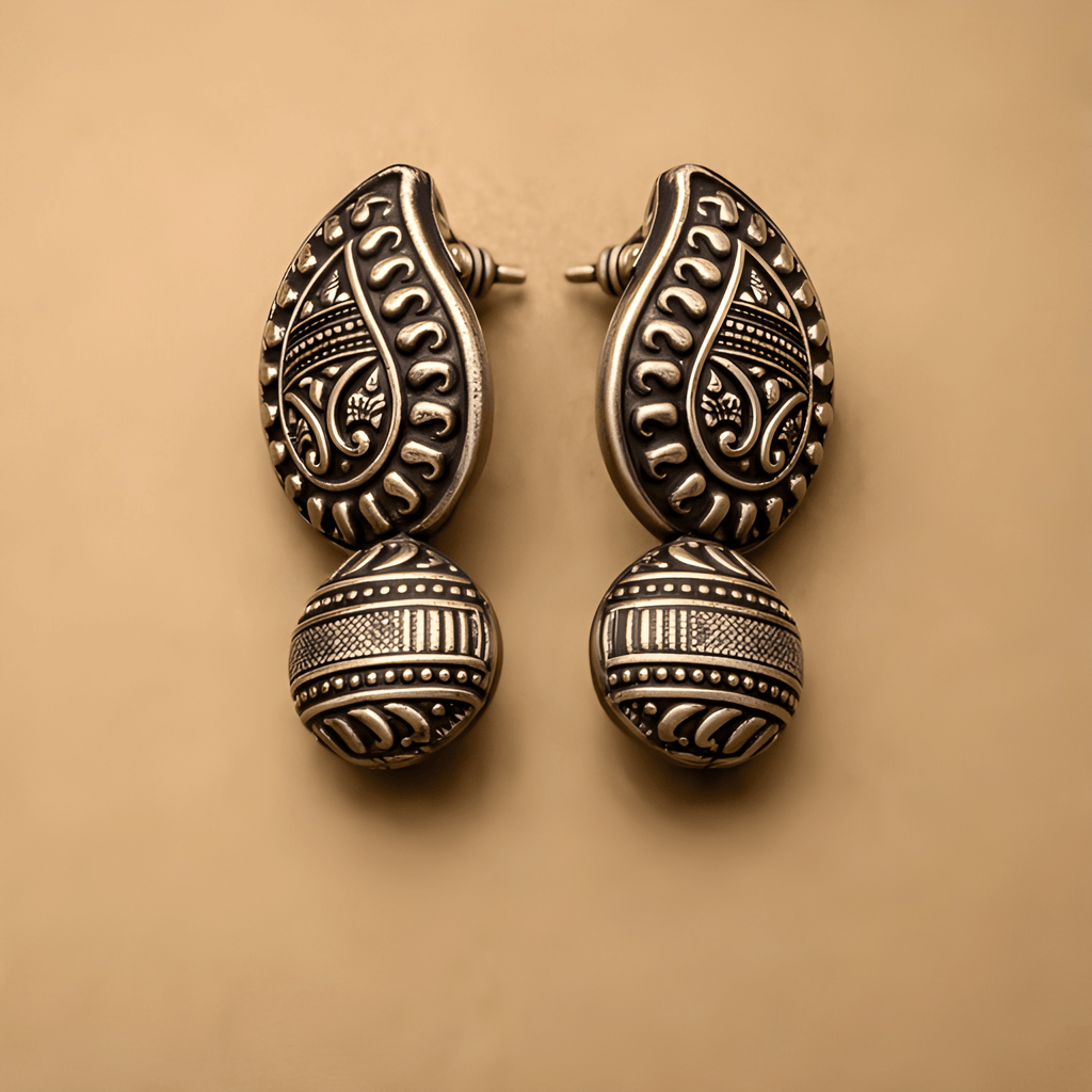 Oxidised silver heritage stud earrings with traditional detailing

