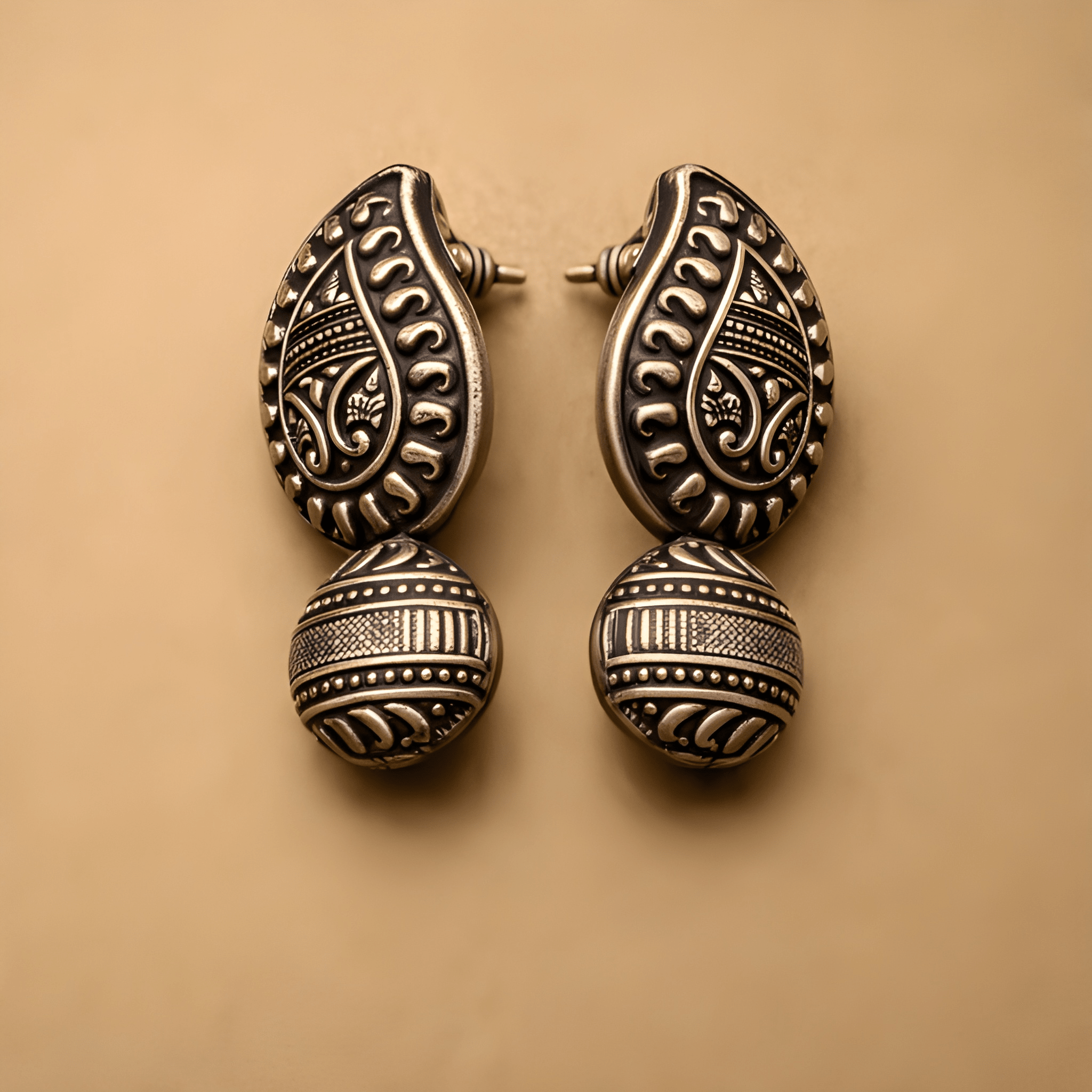 Oxidised silver heritage stud earrings with traditional detailing
