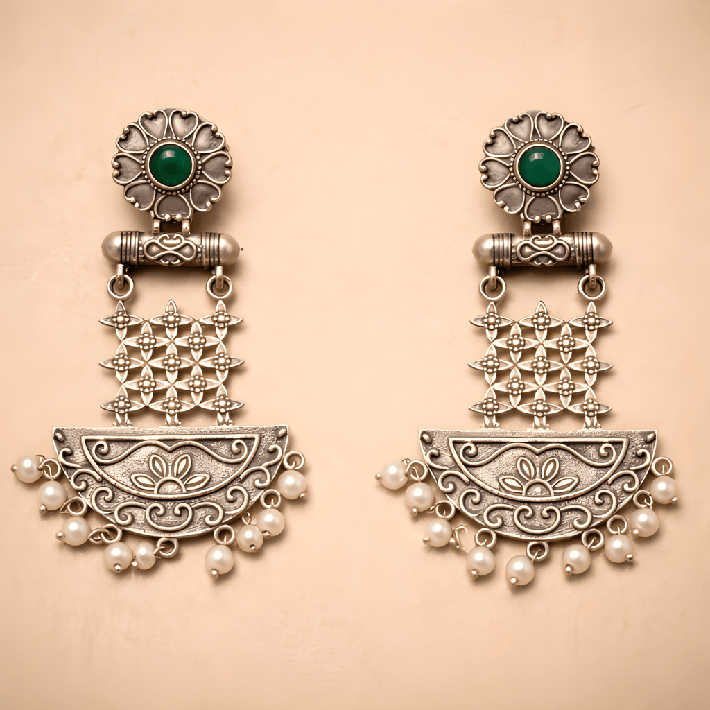 Floral lattice chandelier earrings with pearl fringe on golden background
