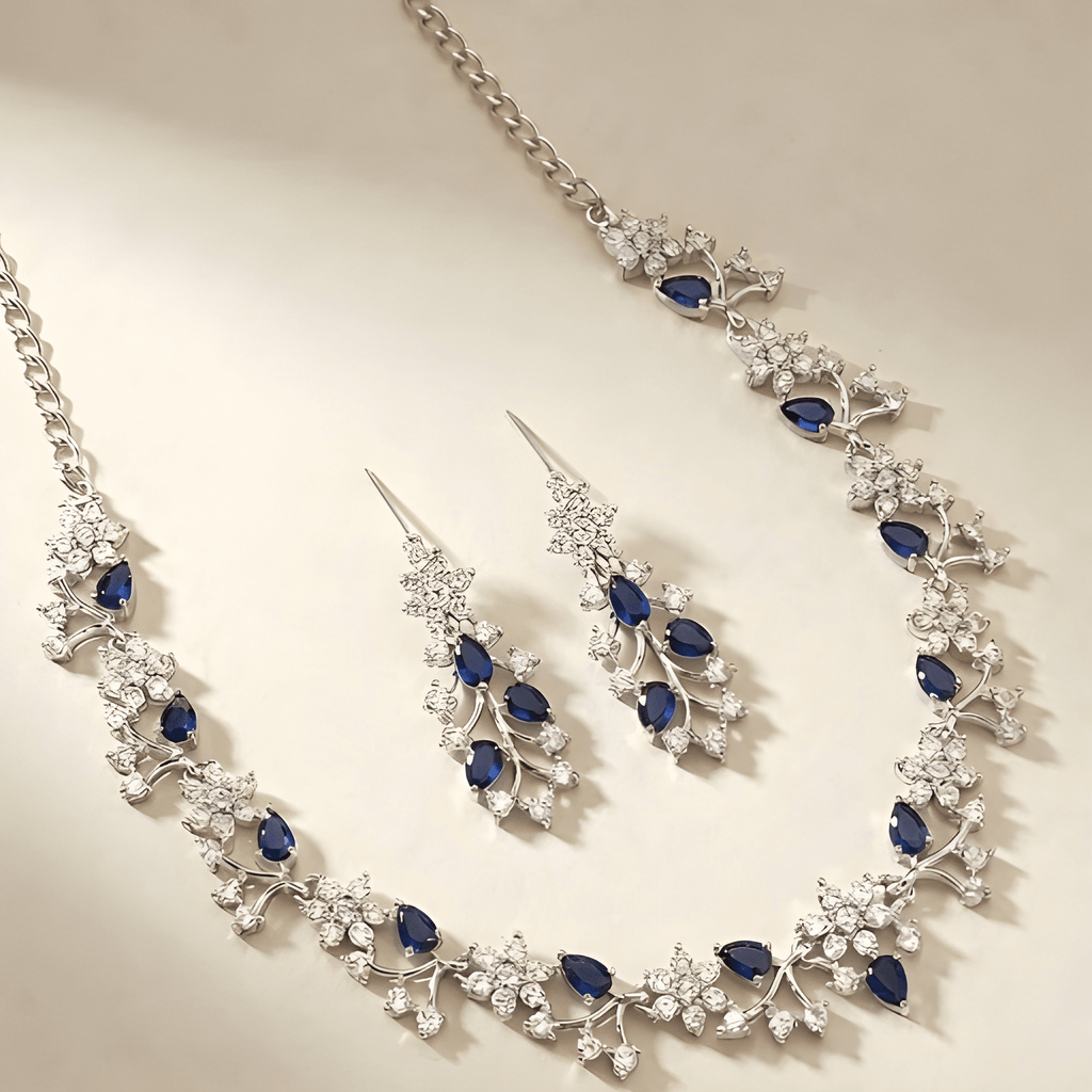 Celestia sapphire crystal necklace set with floral detailing flat lay