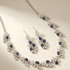 Celestia sapphire crystal necklace set with floral detailing flat lay