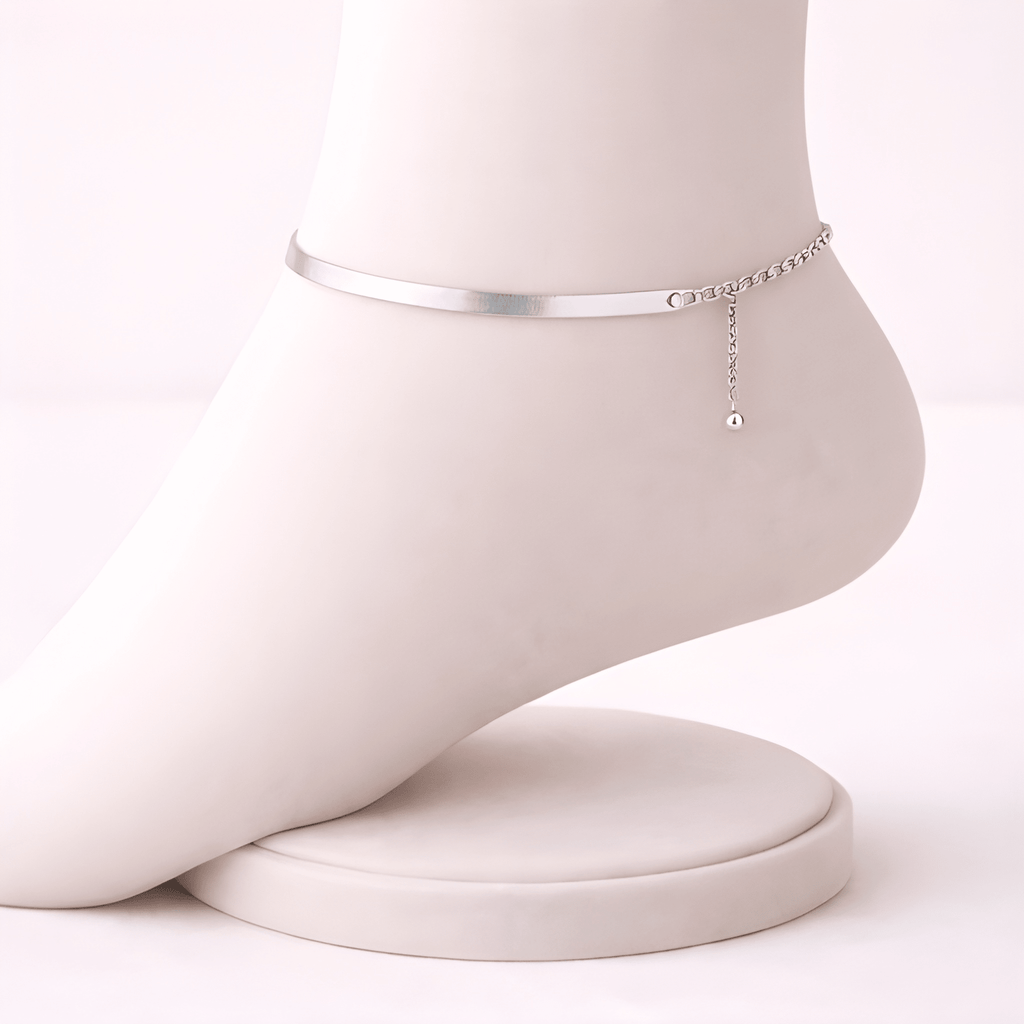 Silver snake chain anklet displayed on ivory mannequin foot