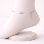 Silver snake chain anklet displayed on ivory mannequin foot