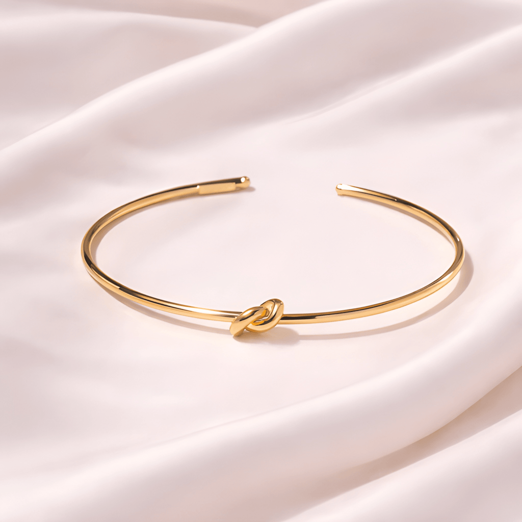 Minimal gold knot cuff bracelet on ivory silk background | Kayahh Jewels