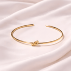 Minimal gold knot cuff bracelet on ivory silk background | Kayahh Jewels