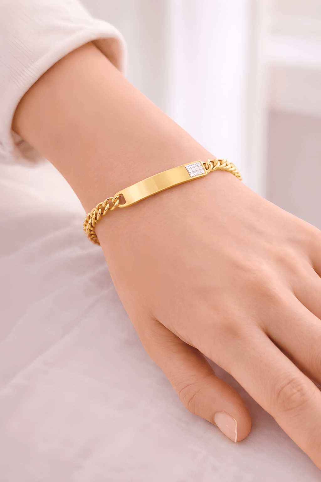 Woman wearing gold ID bracelet with diamond accent | Kayahh Jewels