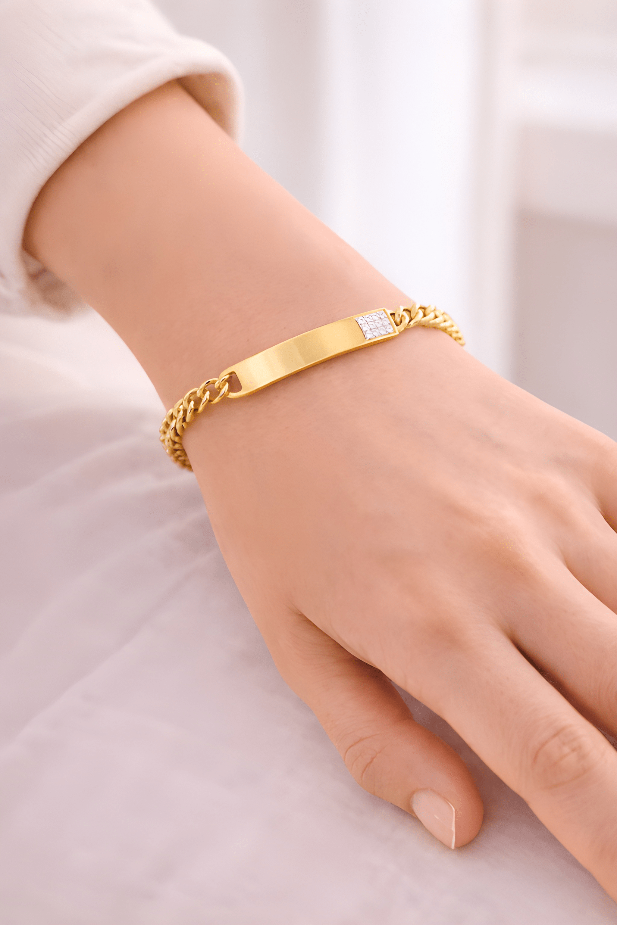 Woman wearing gold ID bracelet with diamond accent | Kayahh Jewels