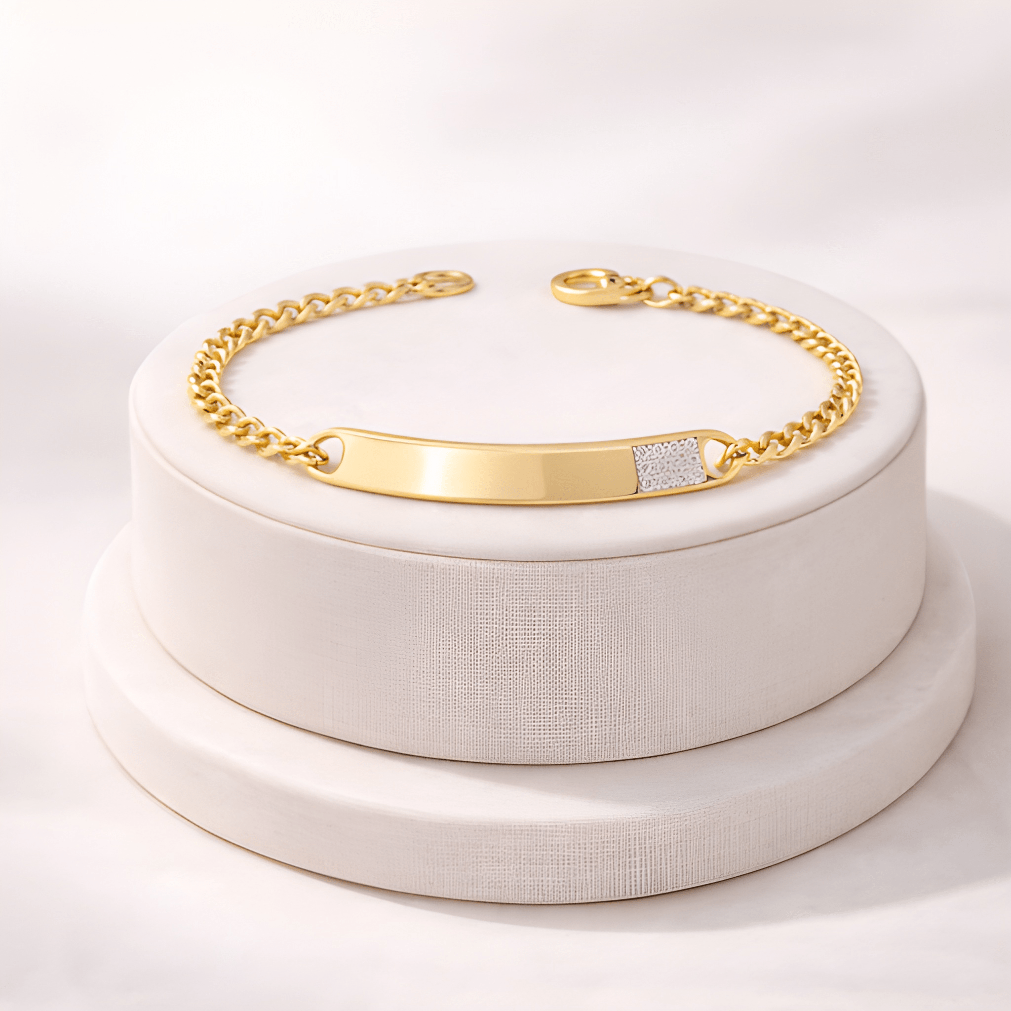 Gold ID bracelet with diamond accent displayed on minimal ivory jewellery stand | Kayahh Jewels