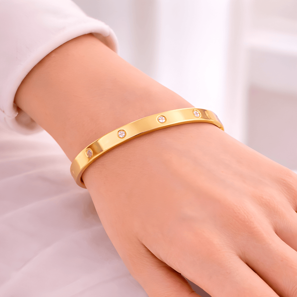 Woman wearing crystal gold bangle bracelet with diamond accents | Kayahh Jewels