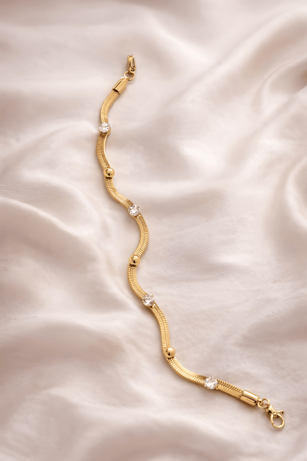 Studded chain bracelet with crystal accents on ivory silk background | Kayahh Jewels