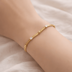 Woman wearing studded chain bracelet with crystal and gold bead details | Kayahh Jewels