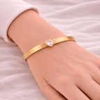 Woman wearing gold heart crystal bangle bracelet | Kayahh Jewels
