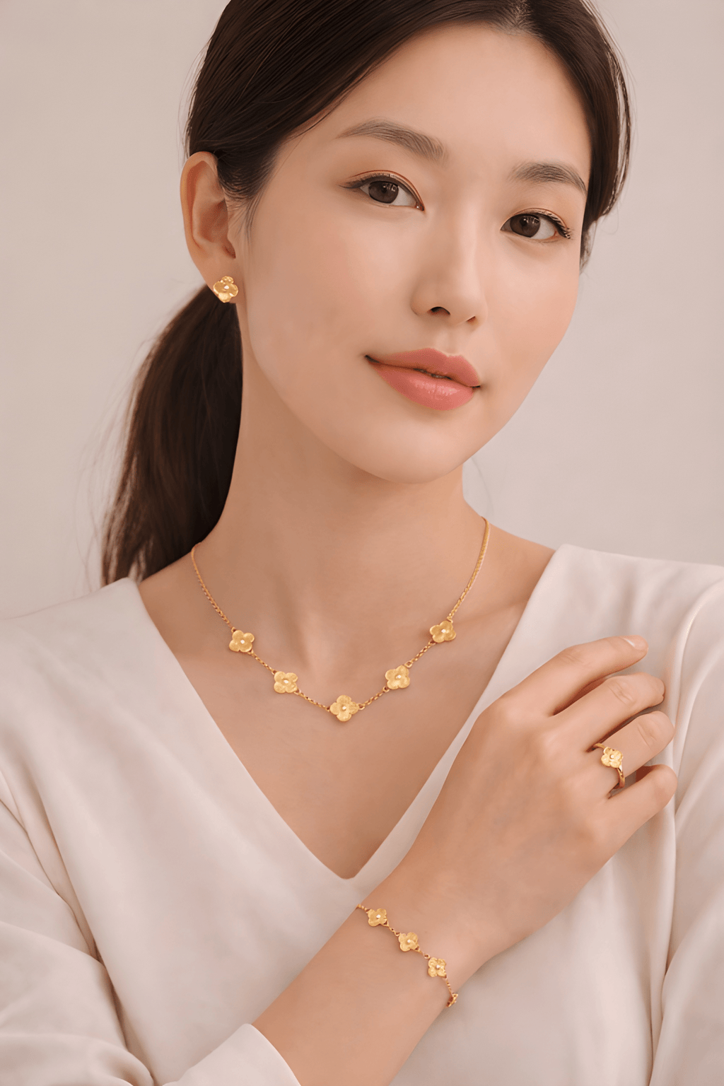 Woman wearing floral clover necklace, bracelet, ring and earrings set | Kayahh Jewels