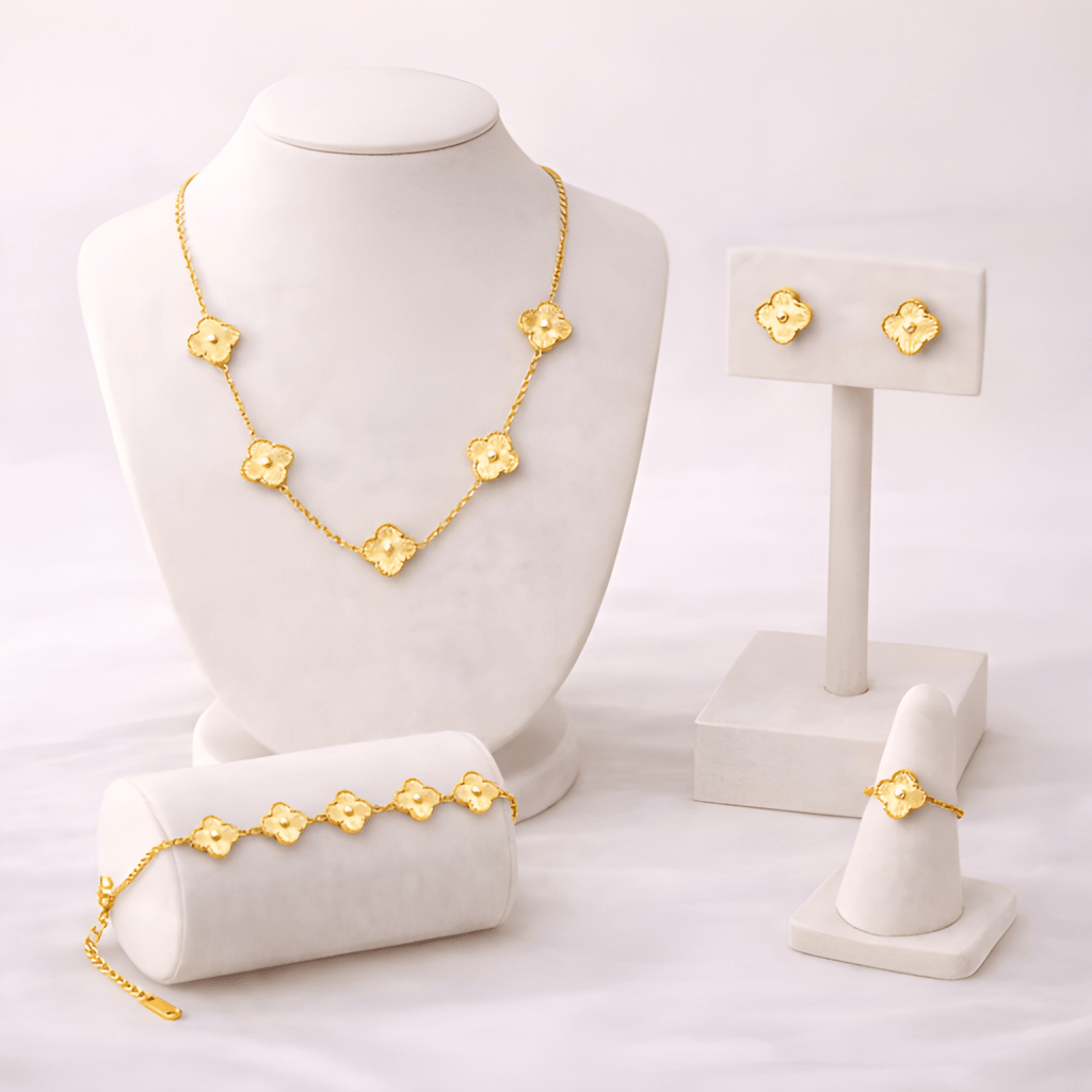 Woman wearing floral clover necklace, bracelet, ring and earrings set | Kayahh Jewels