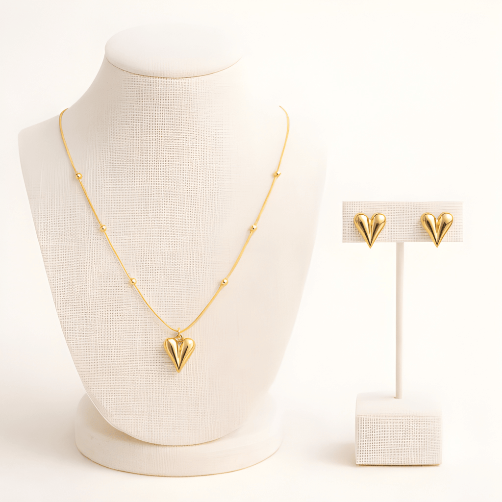 Gold pointed heart pendant necklace set displayed on ivory jewellery stand | Kayahh Jewels