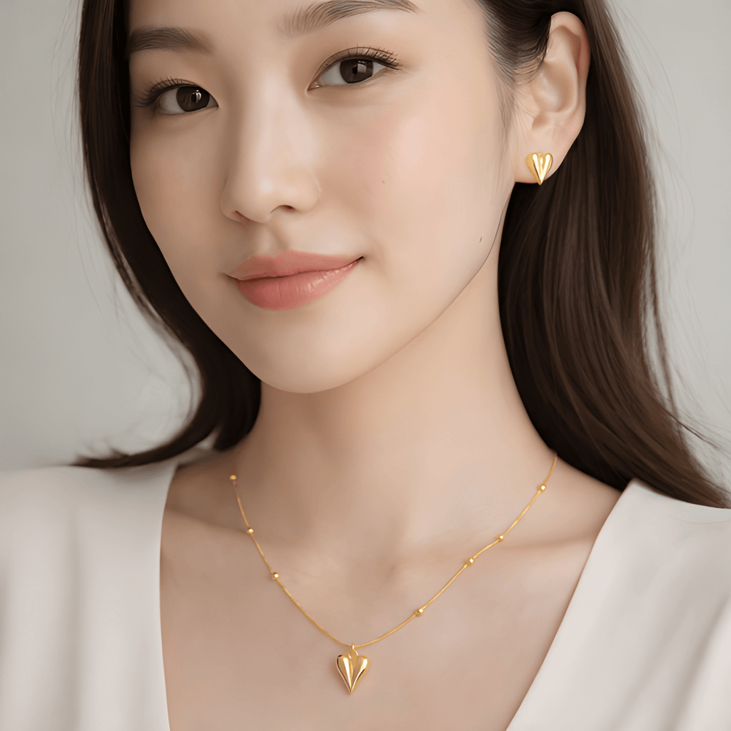 Woman wearing pointed heart pendant necklace and pointed heart stud earrings | Kayahh Jewels