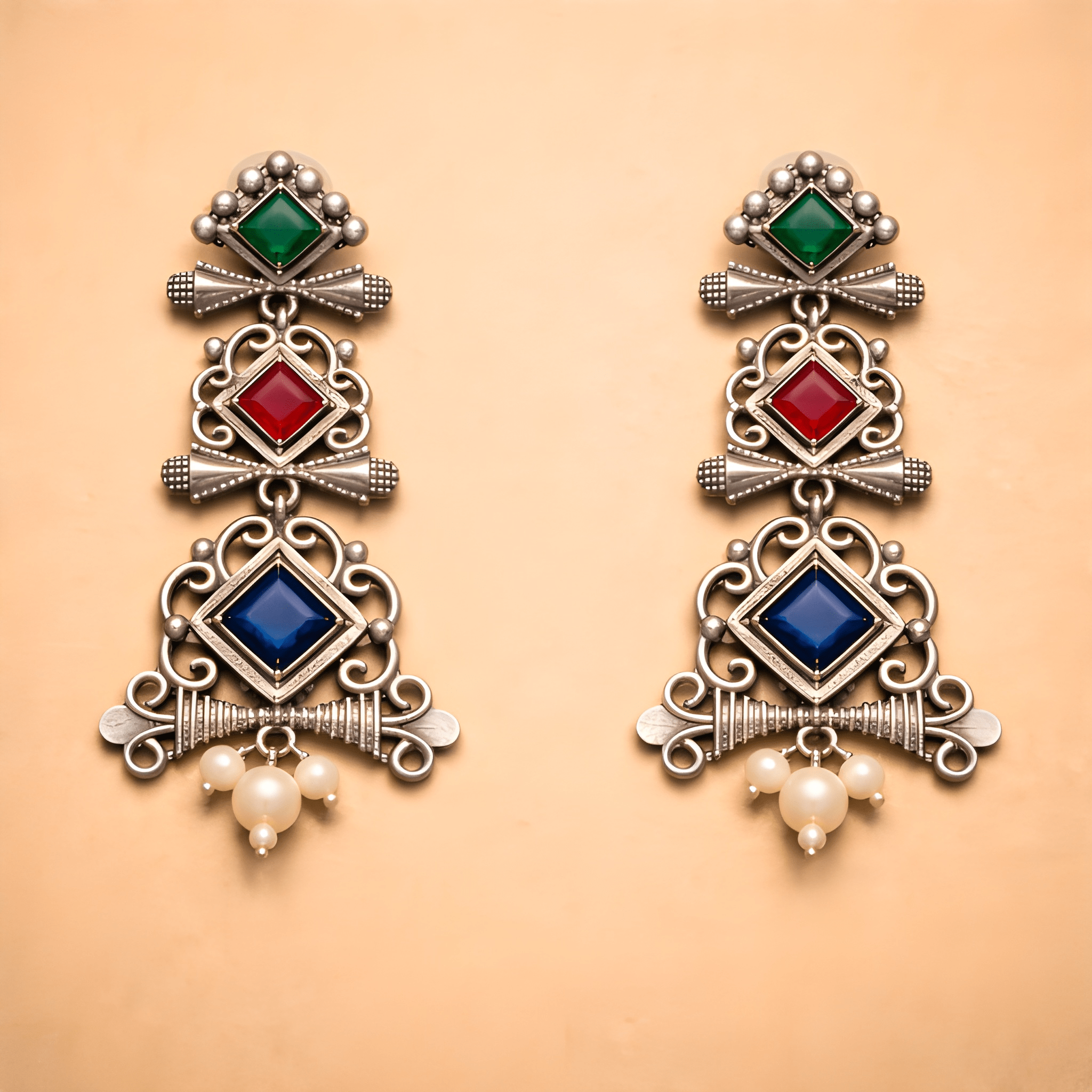 Traditional chandelier dangler earrings with layered geometric design and pearl drop

