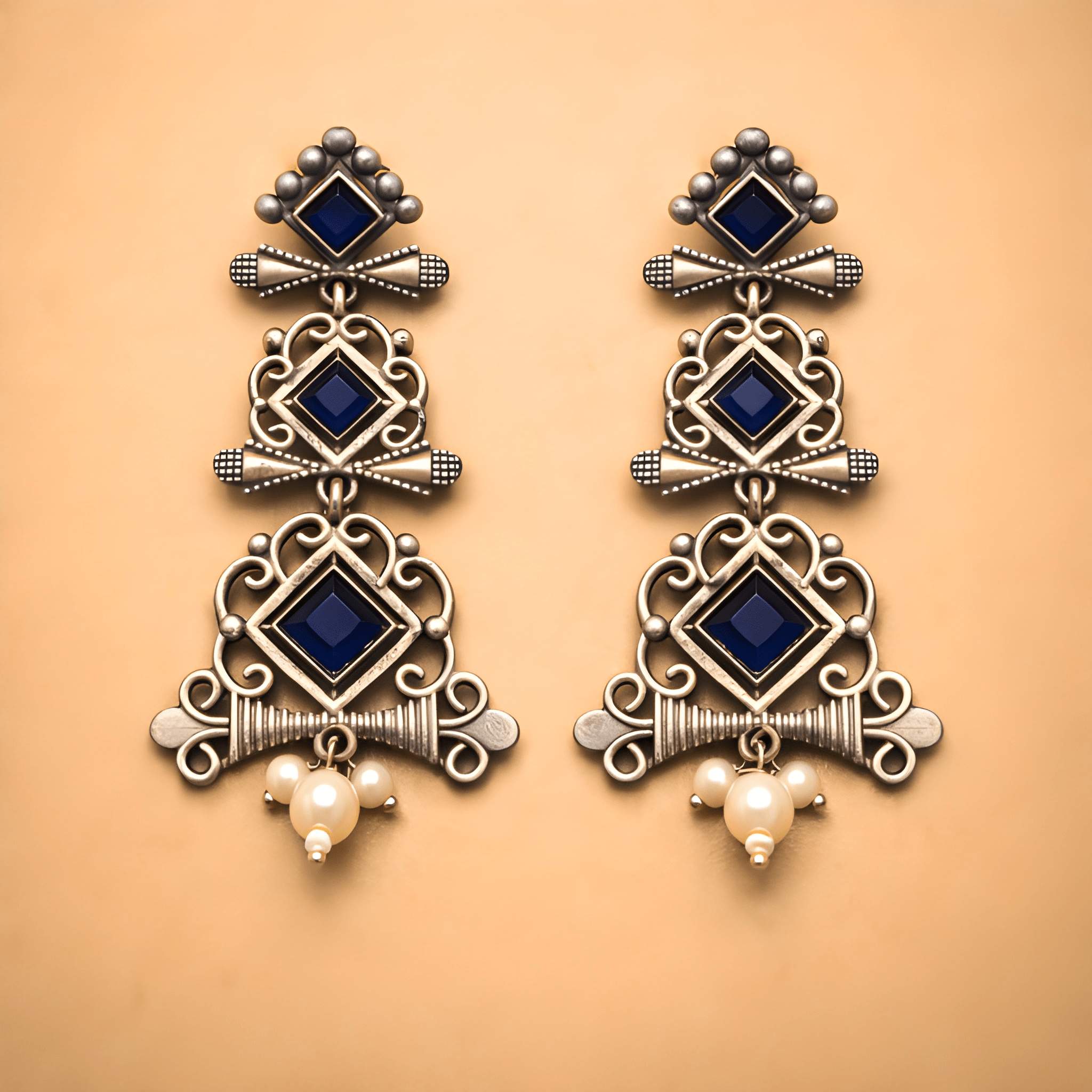 Traditional chandelier dangler earrings with layered geometric design and pearl drop
