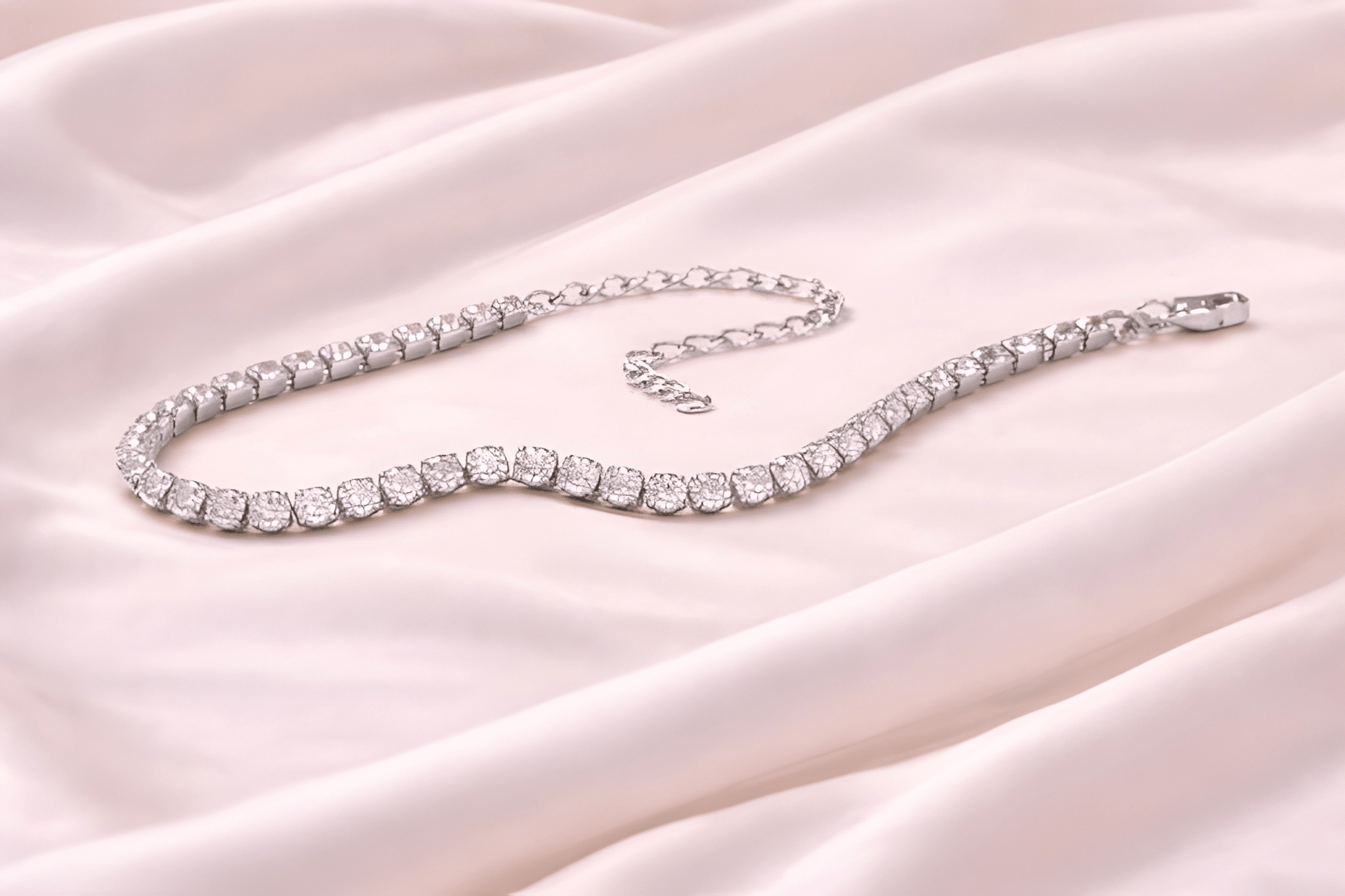 Silver crystal tennis bracelet on ivory silk background | Kayahh Jewels
