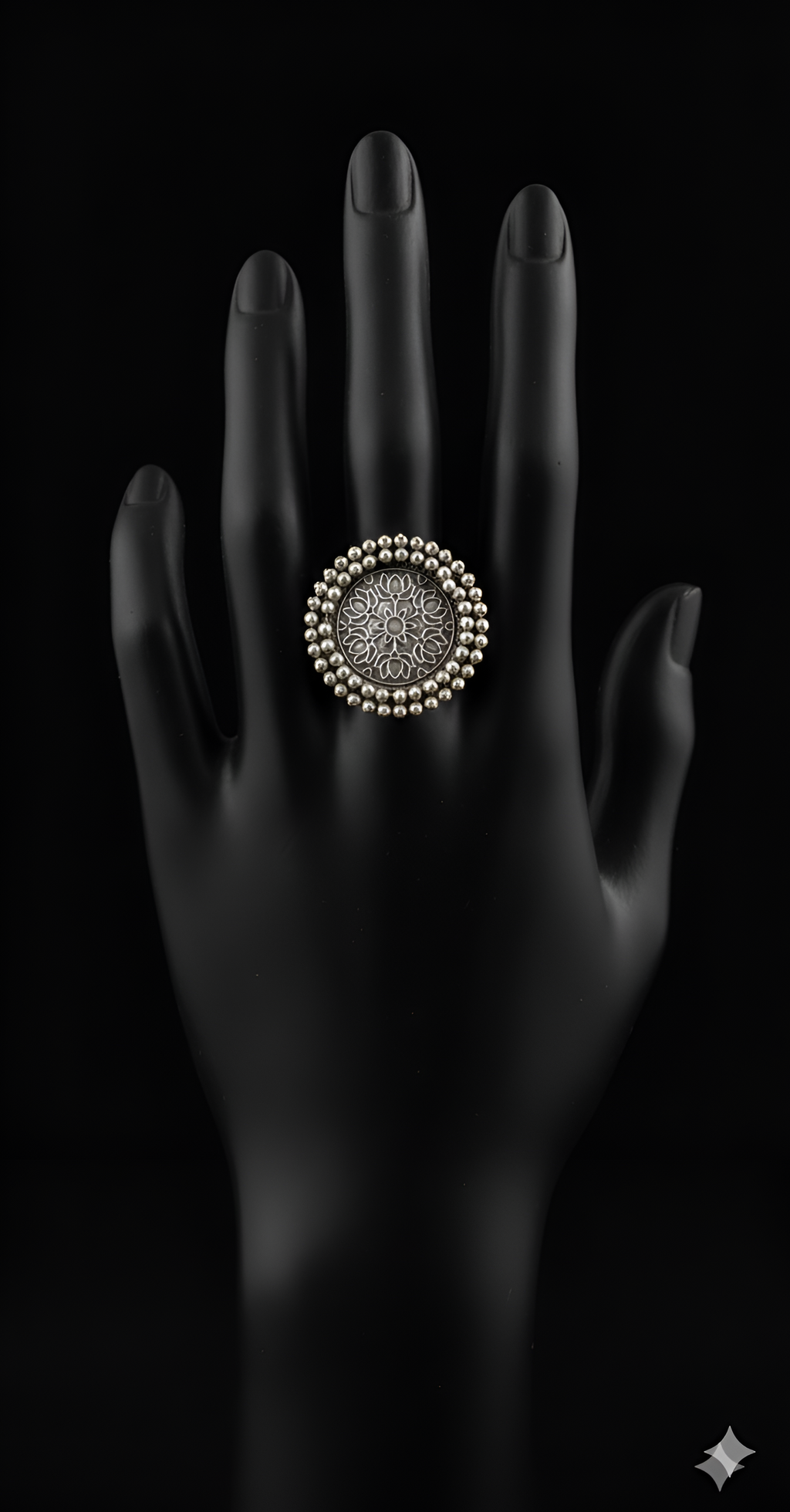 Handcrafted pearl detail oxidised silver statement ring displayed on black hand