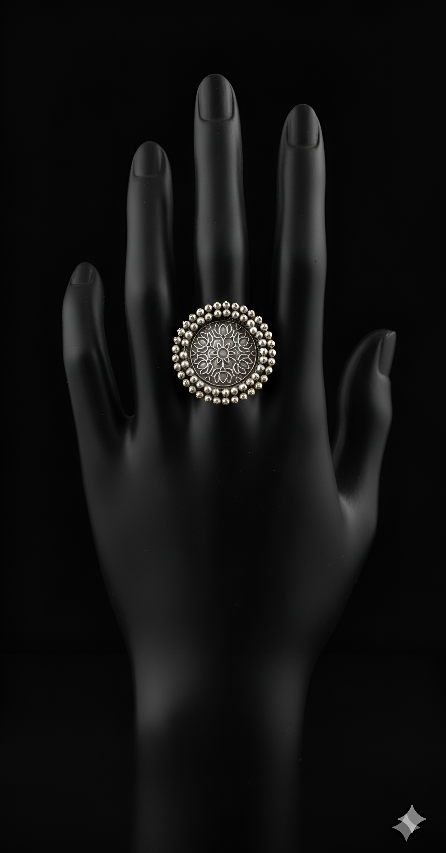 Handcrafted pearl detail oxidised silver statement ring displayed on black hand
