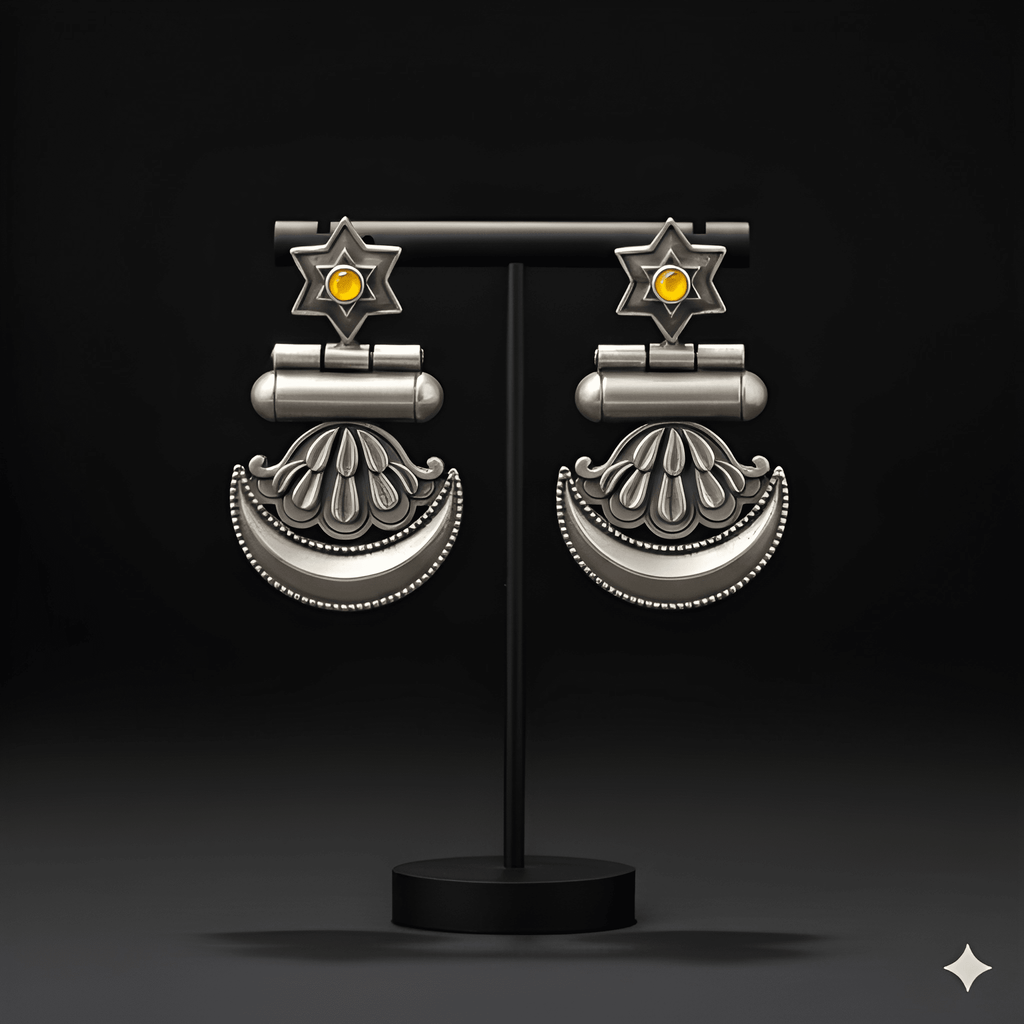 Star crescent dangler earrings displayed on black jewellery stand
