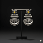 Star crescent dangler earrings displayed on black jewellery stand

