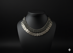 Handcrafted oxidised silver coin neckpiece displayed on bust stand

