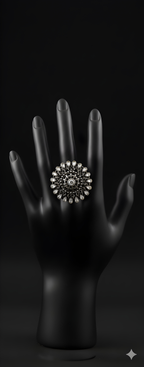 Handcrafted teardrop detail oxidised silver statement ring displayed on black hand