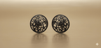 Botanical filigree oxidised stud earrings on golden background
