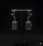 Oxidised birdcage drop earrings displayed on black stand
