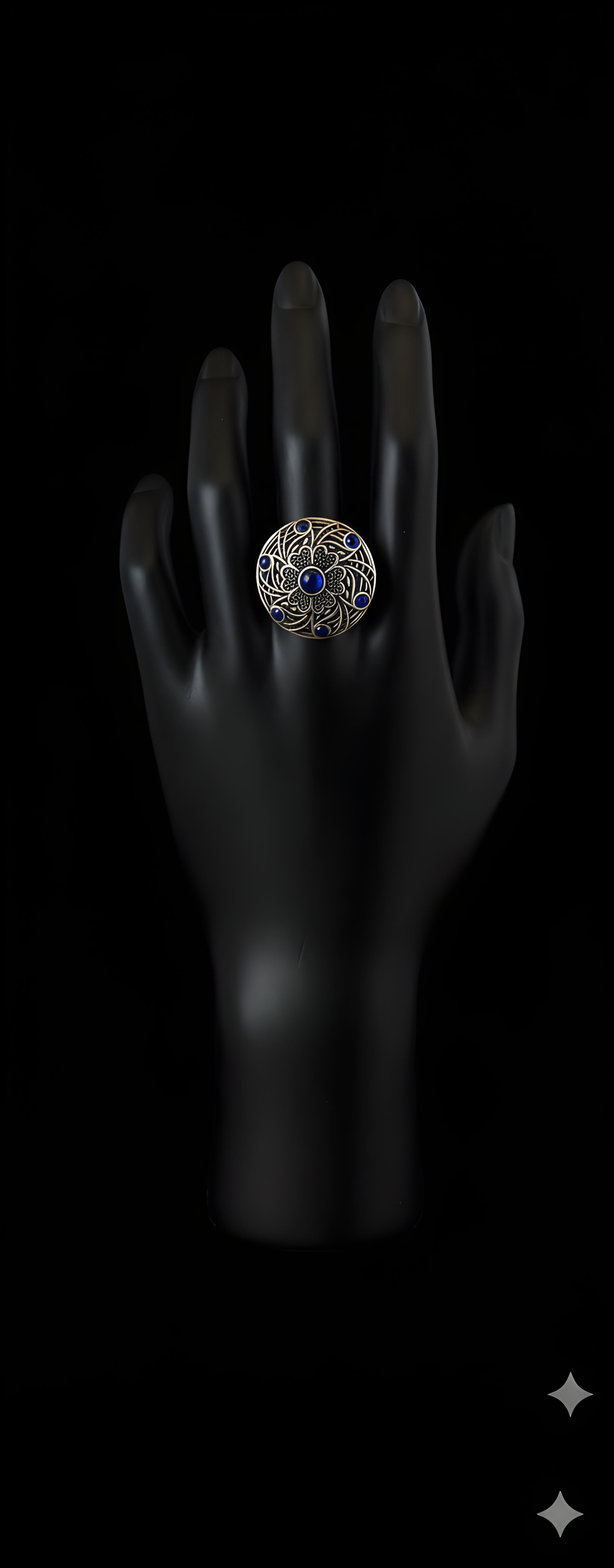 Handcrafted mandala stone statement ring with intricate detailing on black hand display