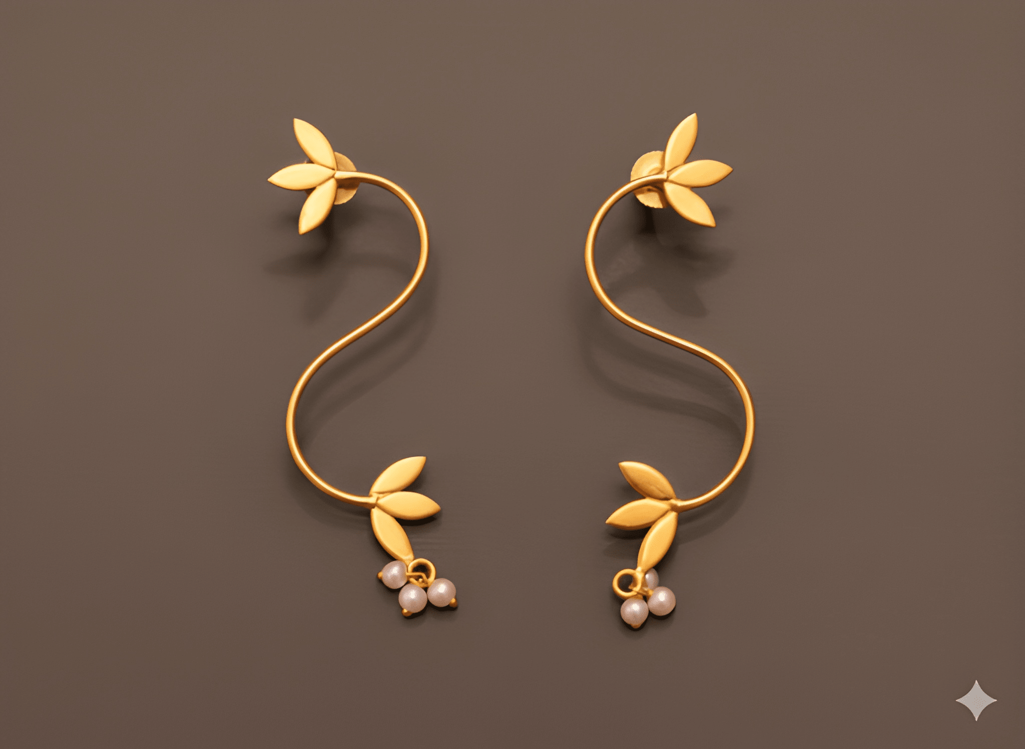 S-shaped vine curve earrings with leaf detailing and pearl drops

