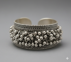 Macro close-up of intricate beaded detailing on handcrafted oxidised silver cuff bracelet
