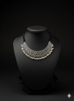 Detailed view of handcrafted oxidised silver pearl choker neckpiece displayed on bust stand
