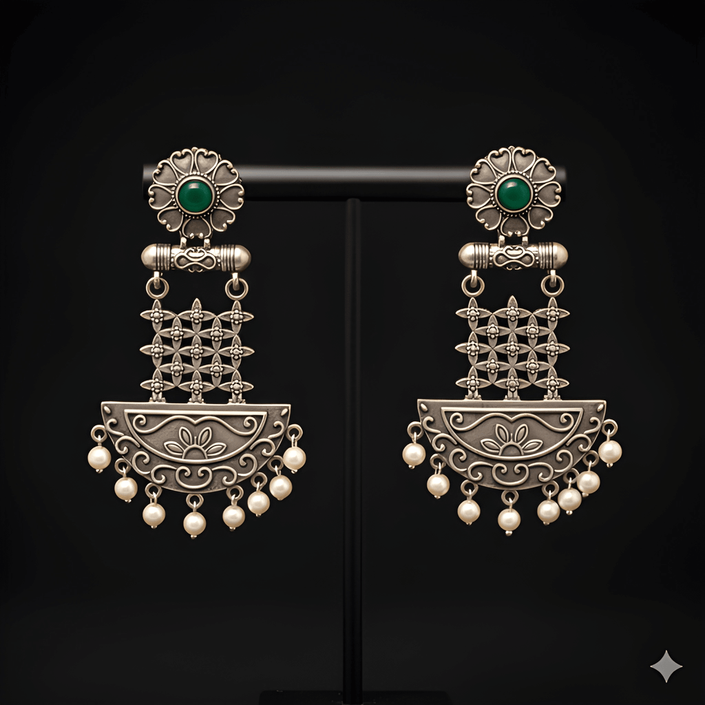 Floral lattice chandelier earrings displayed on black stand
