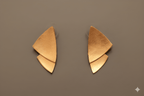 Leaf stud earrings in matte gold finish with layered design
