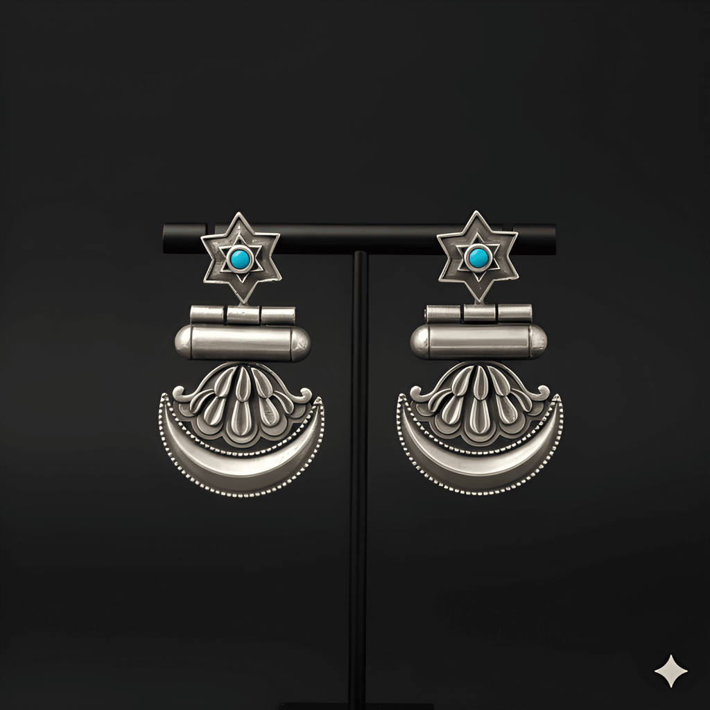 Star crescent dangler earrings displayed on black jewellery stand
