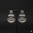 Star crescent dangler earrings displayed on black jewellery stand
