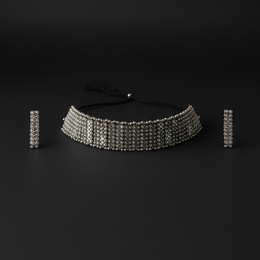 Detailed set of handcrafted oxidised silver beaded choker neckpiece with matching earrings on black background
