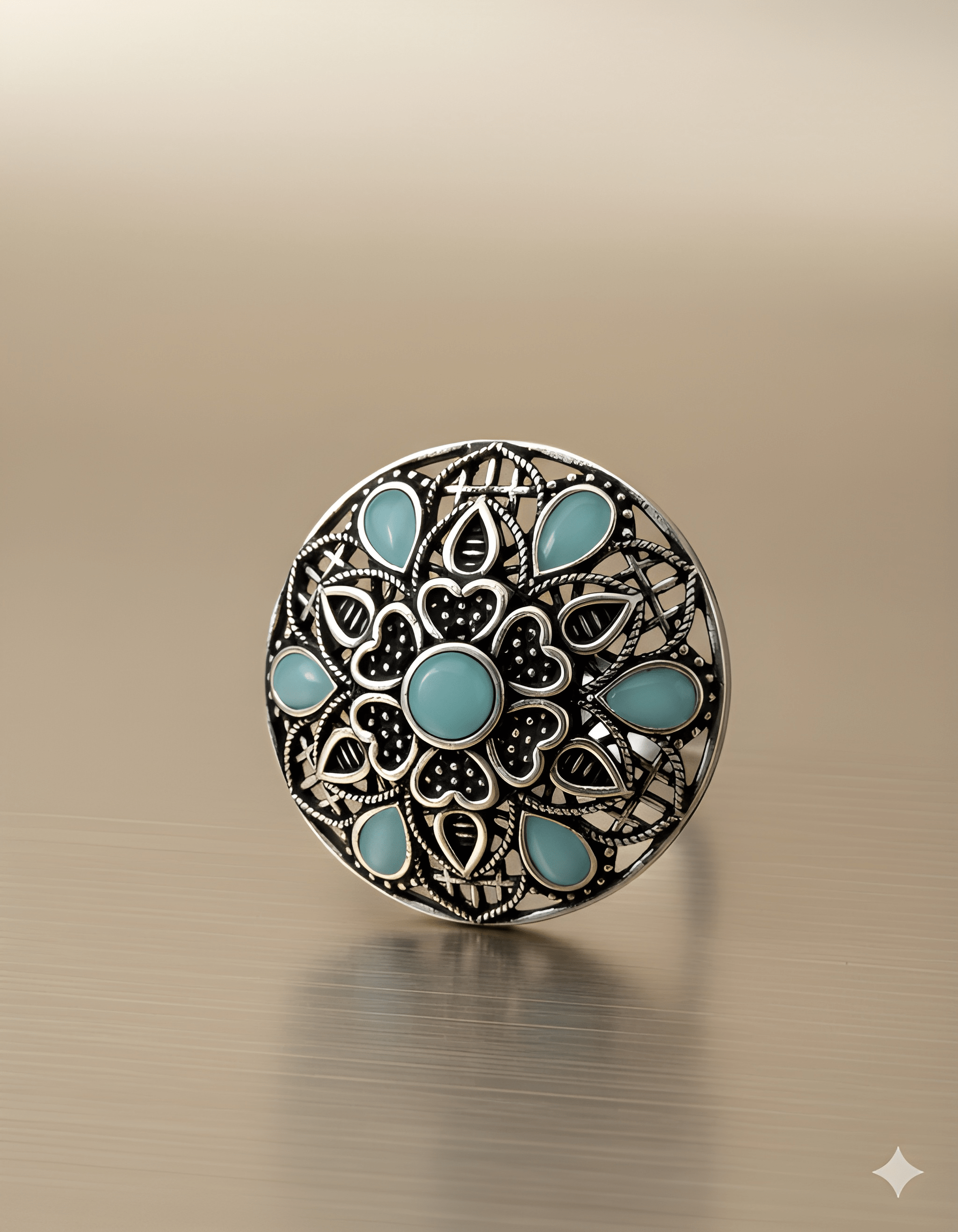 Handcrafted mandala stone ring displayed on golden background