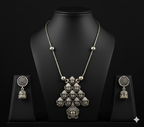 Detailed view of handcrafted oxidised silver deity pendant neckpiece displayed on bust stand
