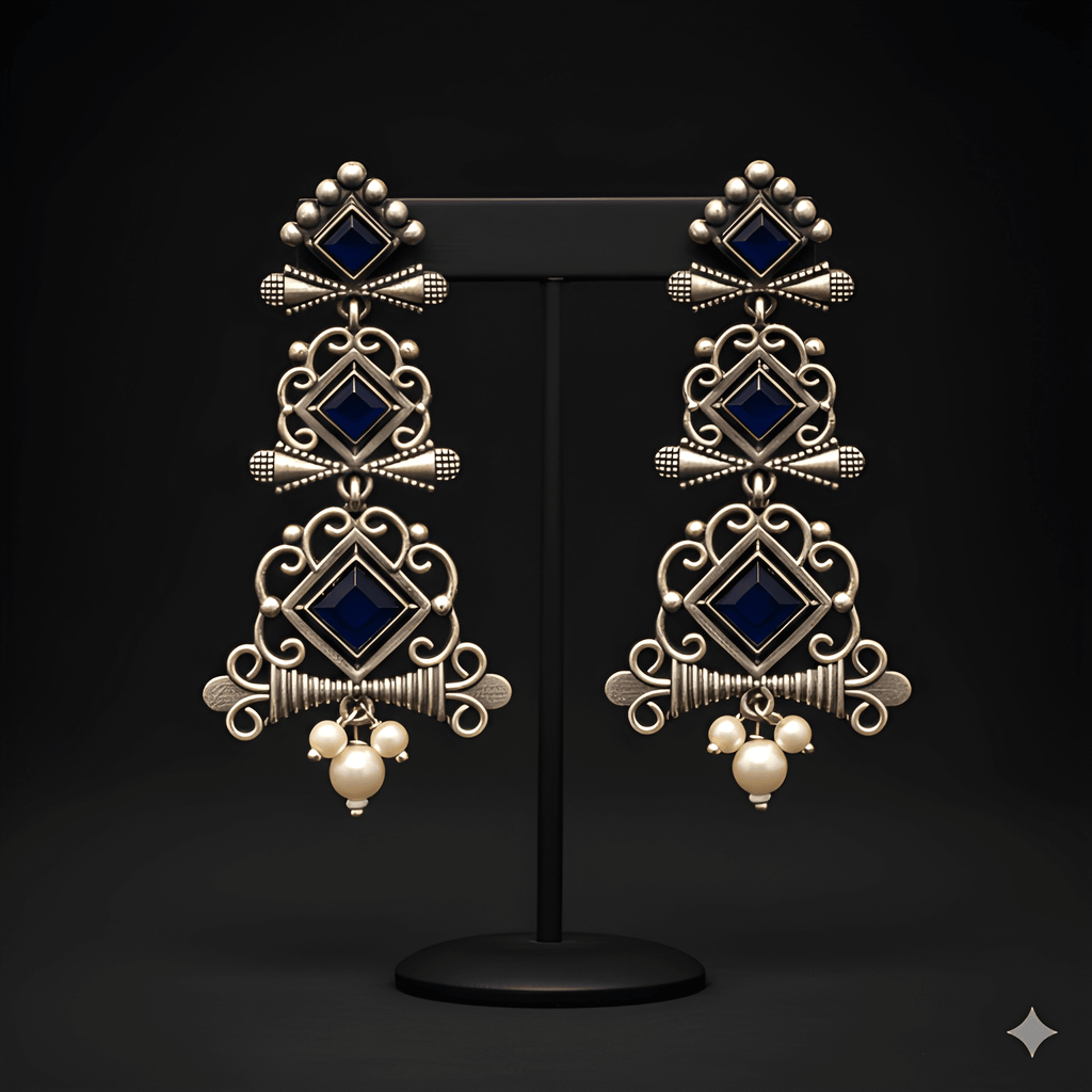 Multi-tier chandelier dangler earrings displayed on black stand
