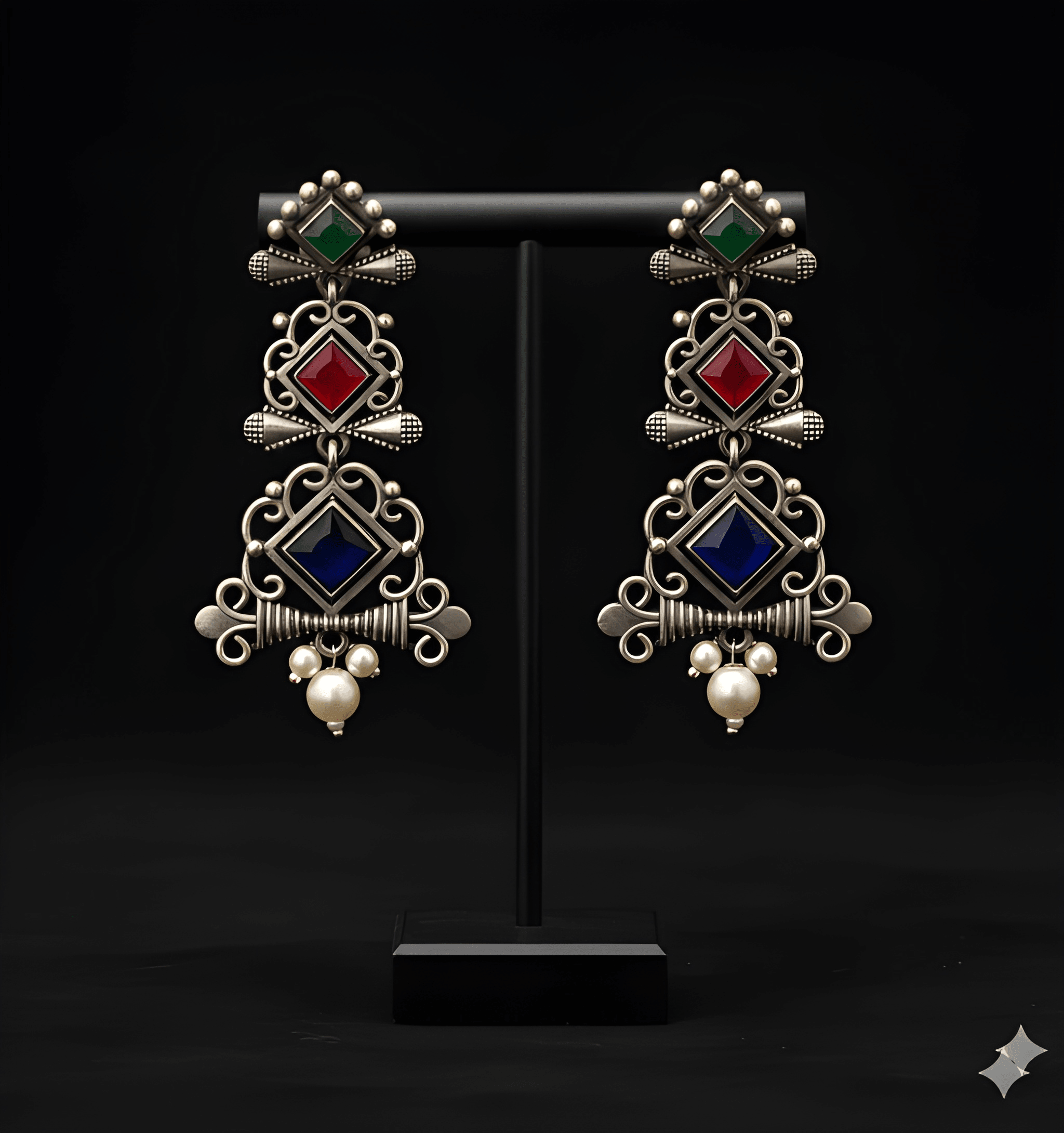 Multi-tier chandelier dangler earrings displayed on black stand
