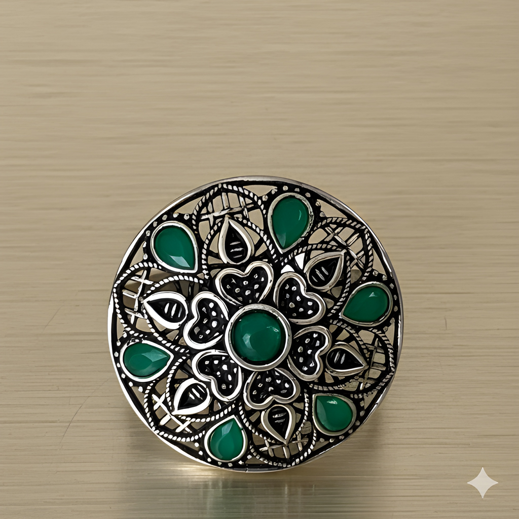Handcrafted mandala stone ring displayed on golden background