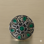 Handcrafted mandala stone ring displayed on golden background